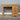A wooden farmhouse dressing table with three drawers